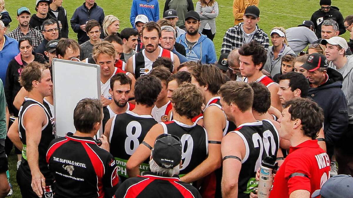 Myrtleford co-coach Brad Murray lays down the law at three-quarter-time of Sunday’s loss to Lavington.