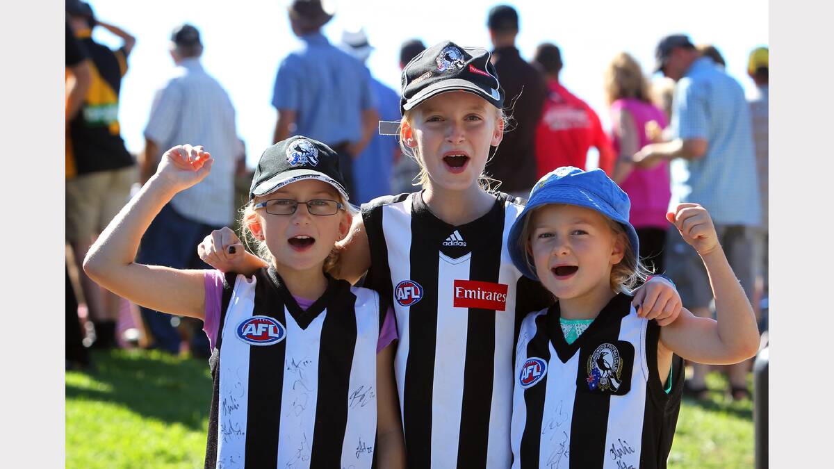 Hannah Snowdon, 9, Millie Carson, 9, and Ruby Snowdon, 6, of Wangaratta, supporting the Magpies.