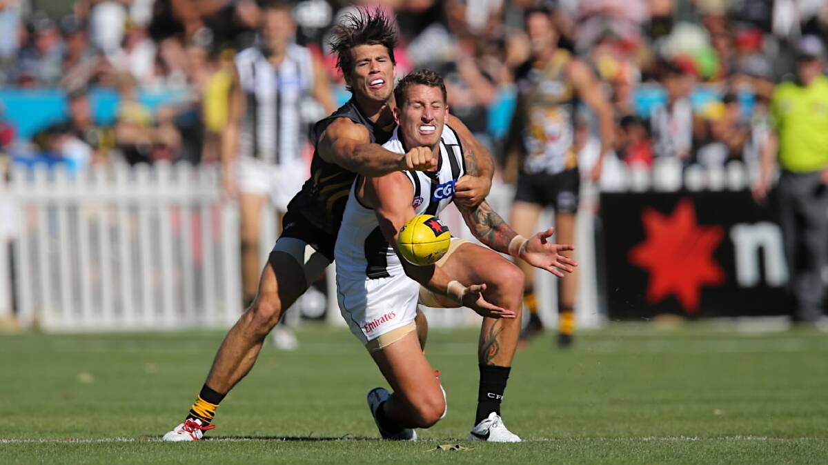 Jesse White and Alex Rance battle for a mark. Picture: FAIRFAX