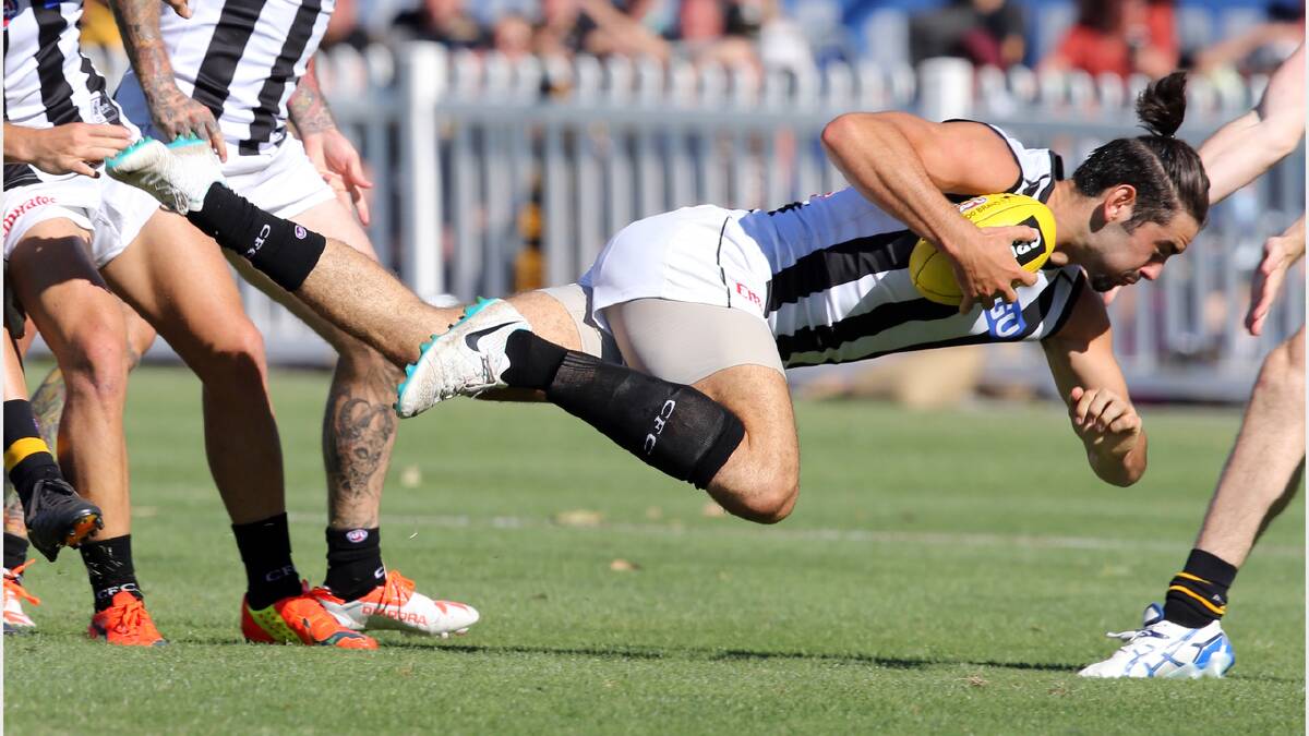 Brodie Grundy takes a tumble.