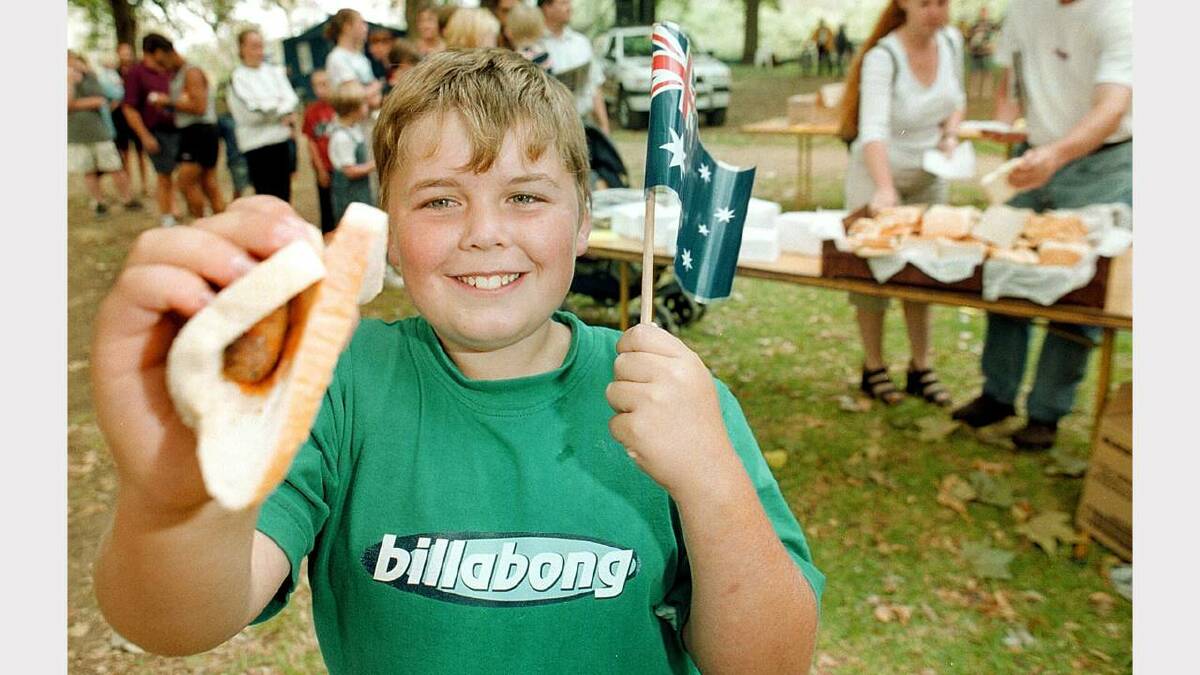 Wodonga's Hadyn Lee, 10, helping himself to a free breakfast at Albury's Noreuil Park on Australia Day. Picture: SIMON DALLINGER