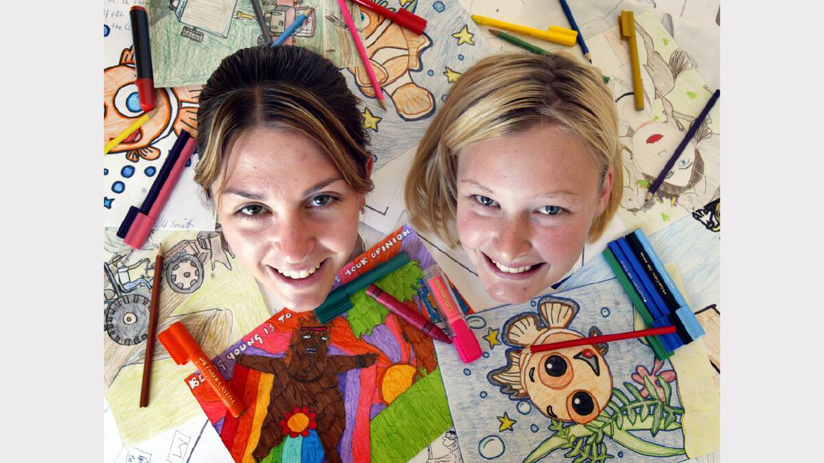 North East Support Action, Wangaratta. National Youth Week Cartoon Competition "What's Exciting about being young and living in the country". On left is Lisa Reginato, receptionist at NESA and on right Meagan Carey, Youth Worker at NESA.