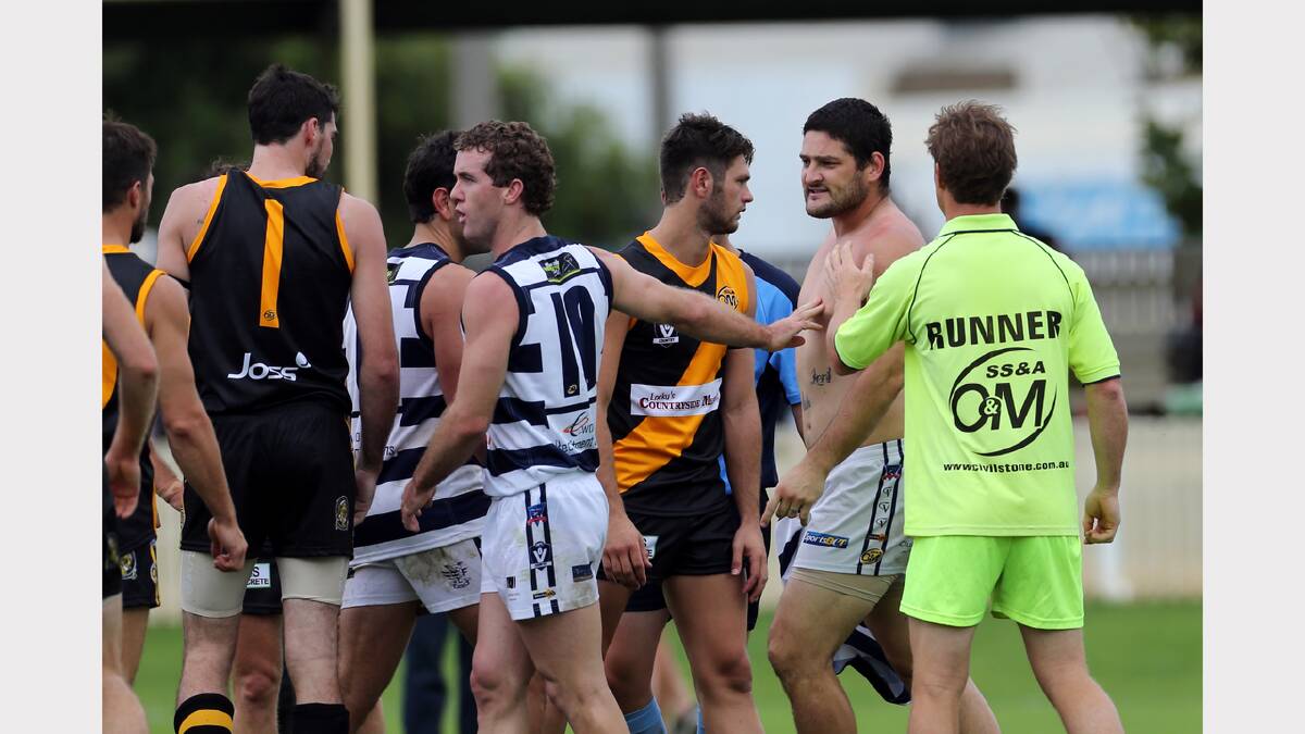 Brendan Fevola lost his shirt during a scuffle.