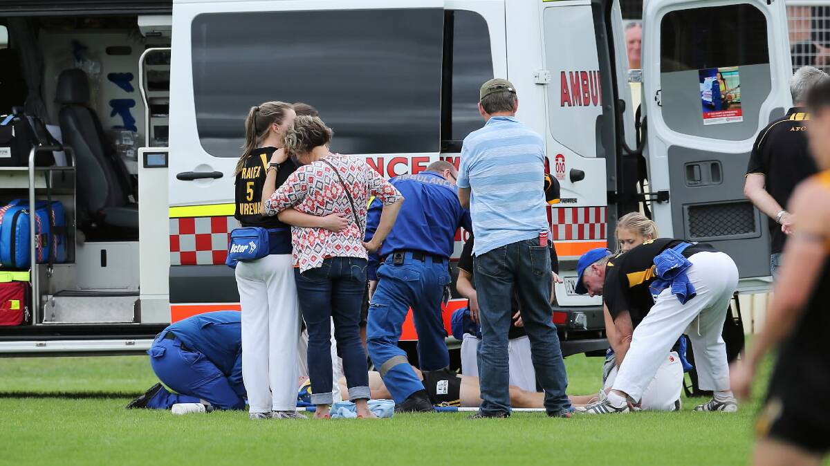 James McQuillan’s parents were on the ground as he was treated by ambulance officers and club trainers after his heavy collision.
