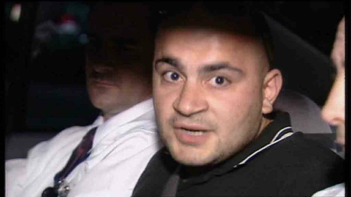 Hizir Ferman after being arrested in 2003. Picture: CHANNEL NINE

