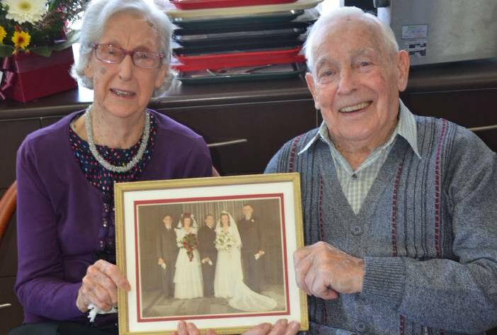 Joy and Norm Miles celebrate their 70th wedding anniversary at Maranatha Lodge on Wednesday with a photo of their wedding day in 1946.
