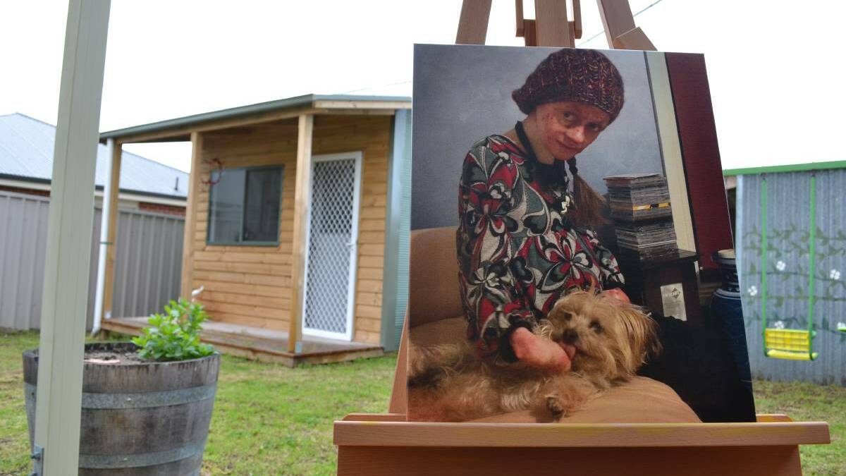 This canvas print of Kate Turner was displayed at her funeral last week. Pictured behind it is 'Pigasso' - the art studio built for Kate by the Lions Club of Victor Harbor and Port Elliot.