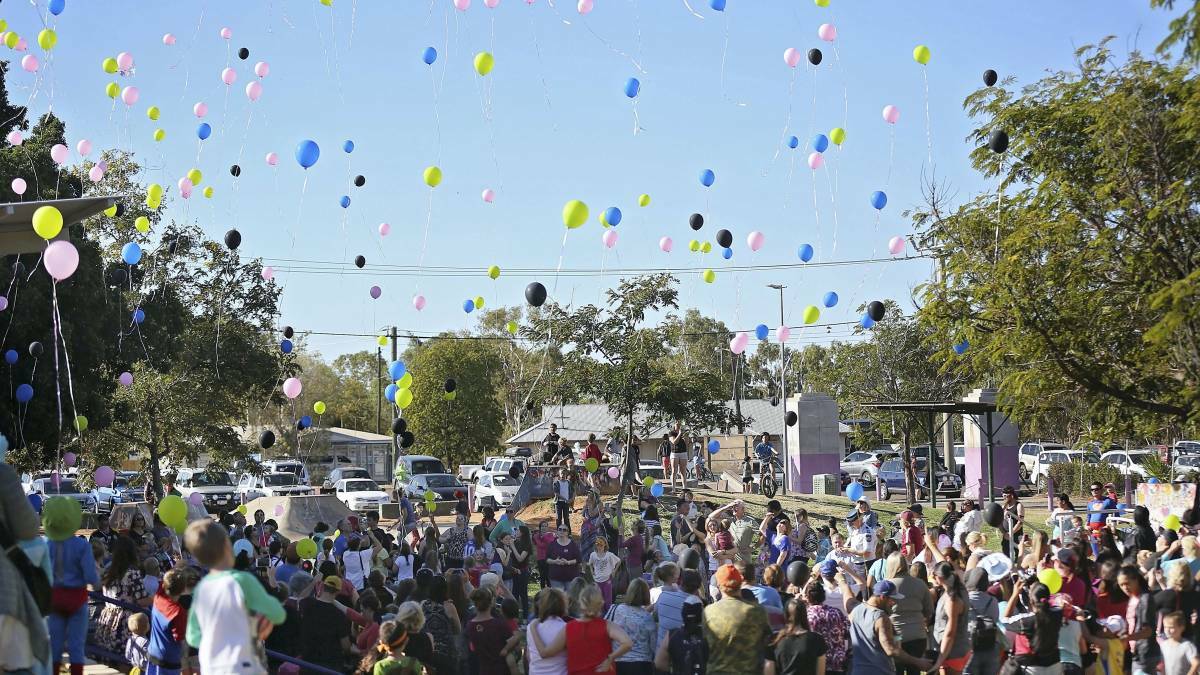About 500 parents and children dressed up, laughed, cried and ate cupcakes to show the Hinder family their support at the Mount Isa Family Fun Park. 