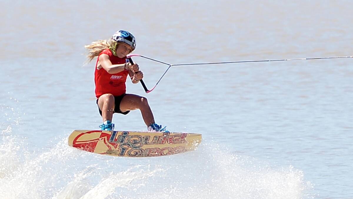 Zahra Kell is a picture of concentration and she gets in the air during the national wakeboarding titles at Wagga's Lake Albert.