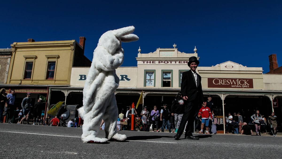 The Easter Bunny walks down Ford Street.