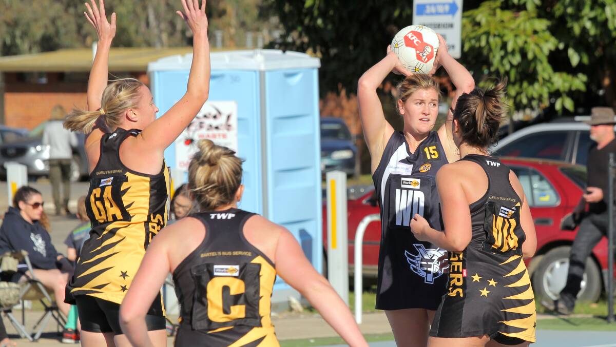 Yarrawonga's Kaitlyn Cummins looked for options as she was surrounded by Tigers players last year. Picture: TARA GOONAN