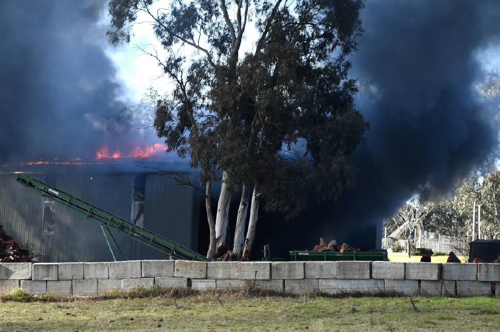 The shed was well alight when firefighters arrived on the scene. Picture: MARK JESSER