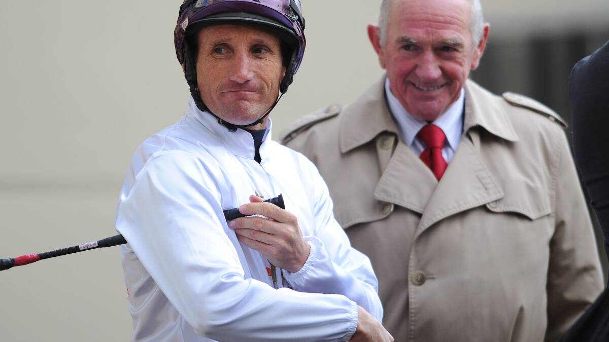 Damien Oliver and trainer Leon Corstens before Commanding Jewel galloped in between races during Melbourne racing. Picture: GETTY IMAGES