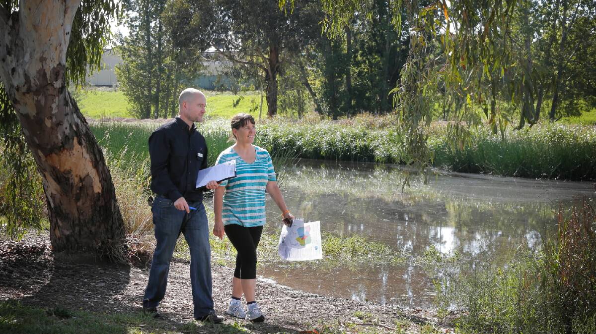 Regional Catchment Strategy co-ordinator Matt O'Connell gets feedback from Wodonga resident Karen Stacey about the future plans for the North East waterways. Picture: TARA GOONAN