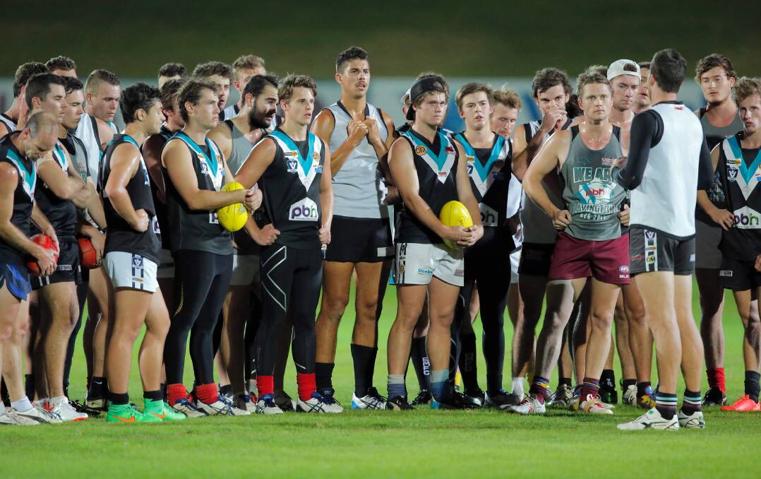 Lavington coach James Saker talks to his players ahead of tomorrow night’s showdown against Yarrawonga at Lavington Oval. Picture: KYLIE ESLER