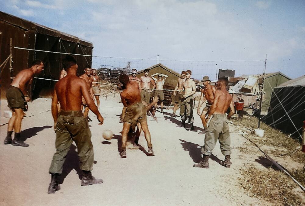 Soldiers playing volleyball at the Bien Hoa base.
