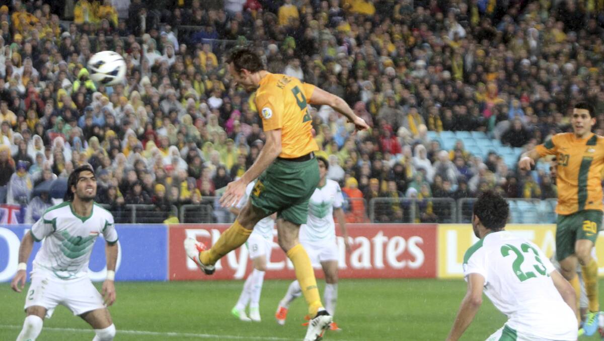 Josh Kennedy high in the air as he puts the match-winning goal in the back of the net.  