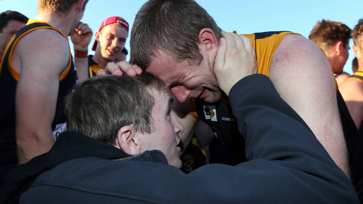  James McQuillan and Chris Hyde share an emotional moment after the match. Picture: MATTHEW SMITHWICK