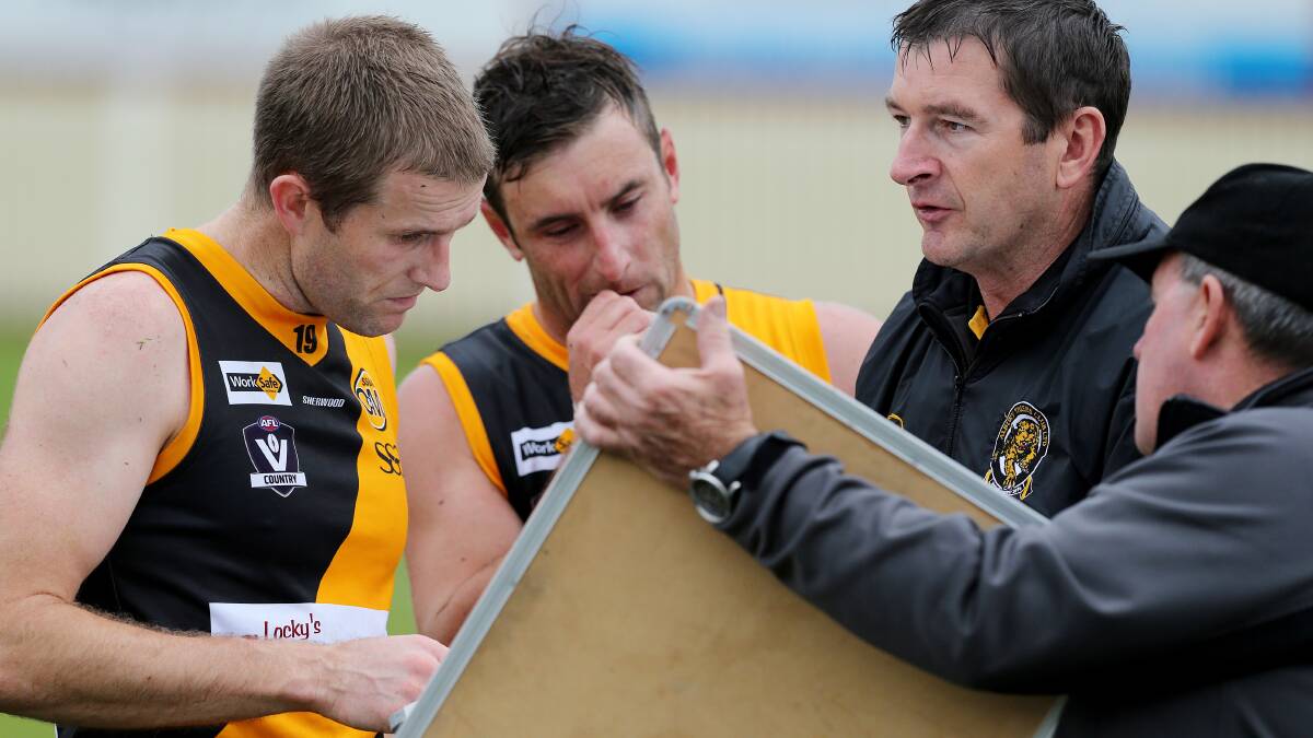 Chris Hyde and Daniel Maher talk through team strategy. Picture: JOHN RUSSELL