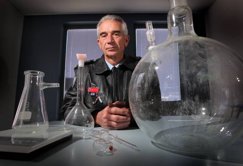 Albury Inspector David Cottee with glassware used for manufacturing methamphetamine. These items has been confiscated as part of a police drug operation. Picture: DAVID THORPE 
