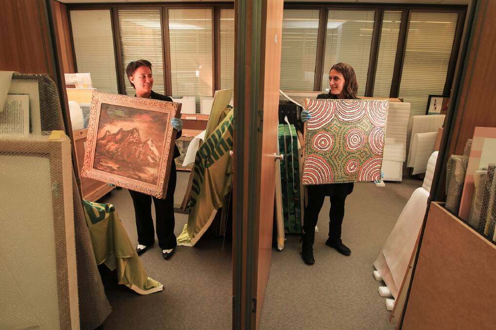 Director Jacqui Hemsley and curator Bianca Acimovic with works that are yet to be hung. Picture: DYLAN ROBINSON