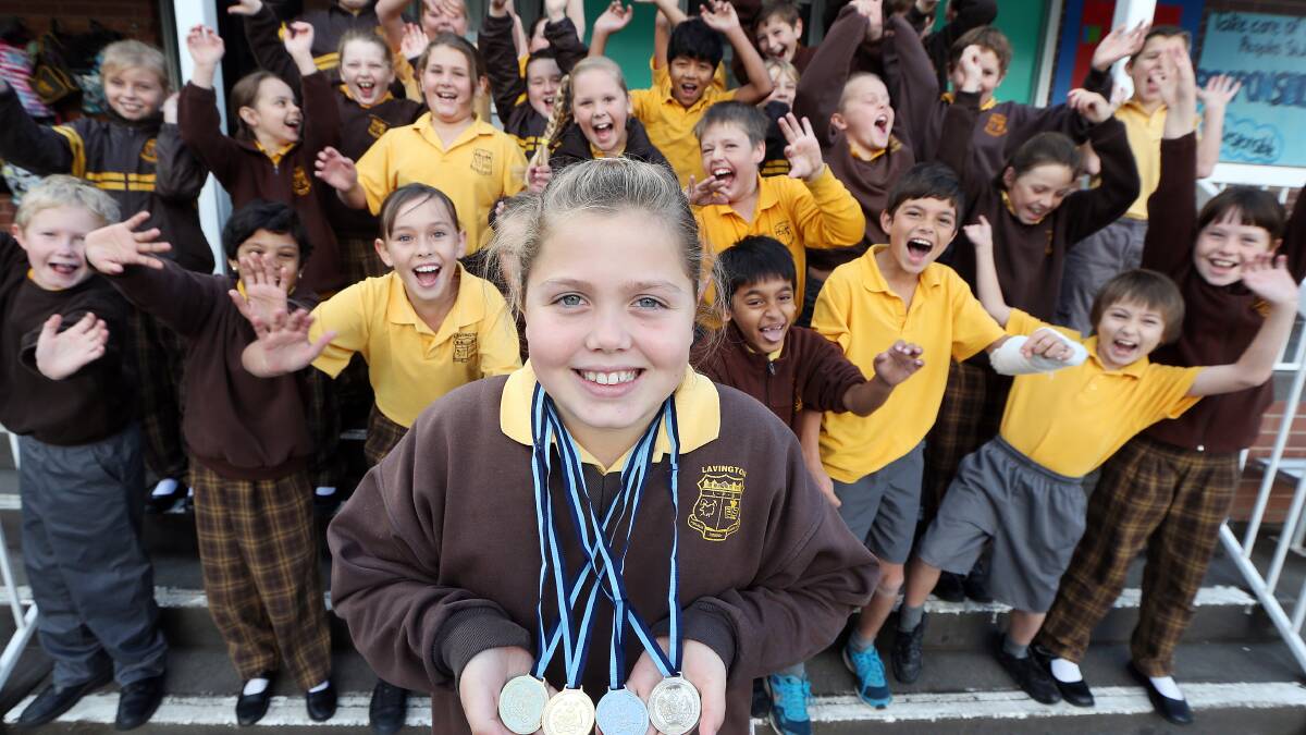 Brooke King and classmates celebrate her swimming success. Picture: JOHN RUSSELL
