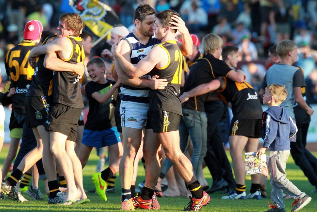  Brendan Fevola and Joel Mackie embrace at the end of the game. Picture: KYLIE ESLER