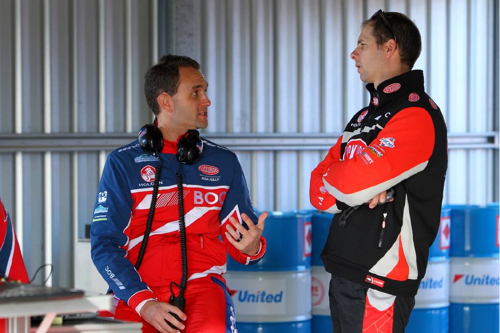Brad Jones Racing drivers Andrew Jones and Luke Youlden have a chat in the pits. 