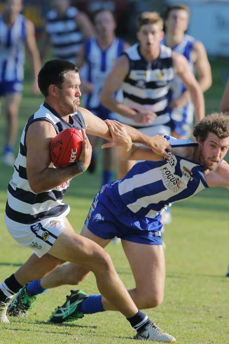 The Roos' Al Austin and Yarrawonga's Brad O'Connor.