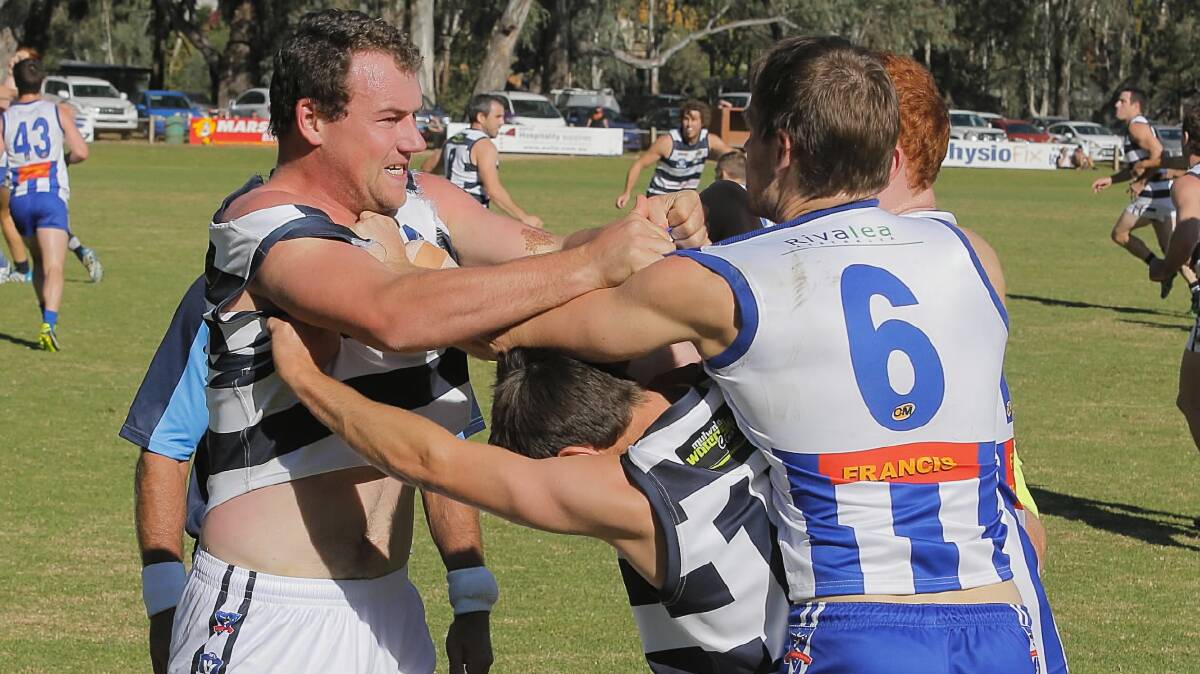 Yarrawonga's Ed Bayles got into a scuffle with the Roos' Bryce Campbell and John Robinson. 