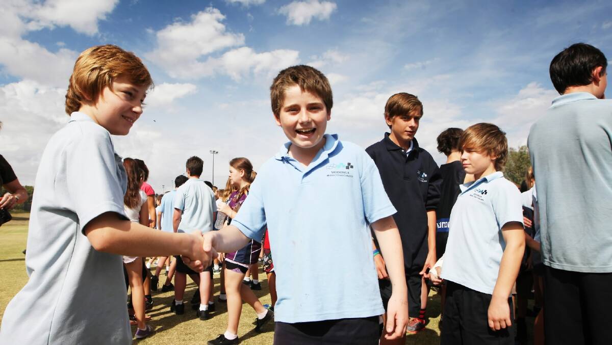Year 7 students Thomas Stanley and Damien Paterson shake hands. Picture: DYLAN ROBINSON