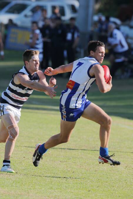 The Roos' Dave Riddle and Yarrawonga's Mark Athanitis.