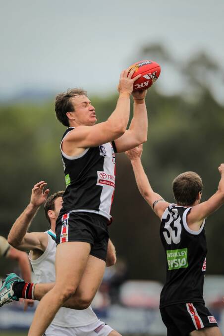 Myrtleford's Tom Hargreave beats the pack. 