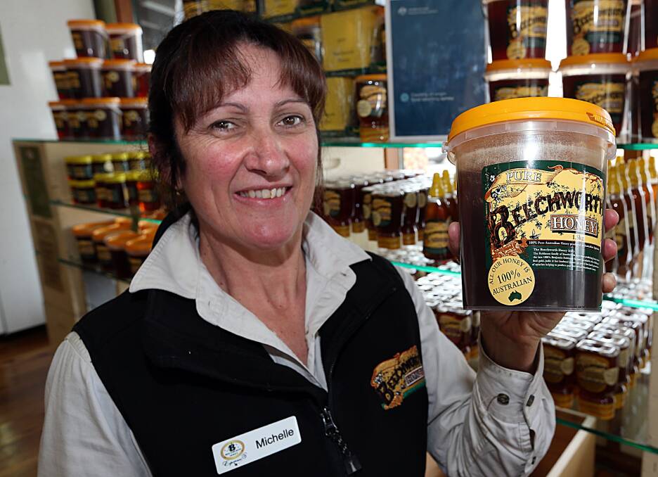 Beechworth Honey retail manager Michelle Munro with some Australian honey. Picture: PETER MERKESTEYN