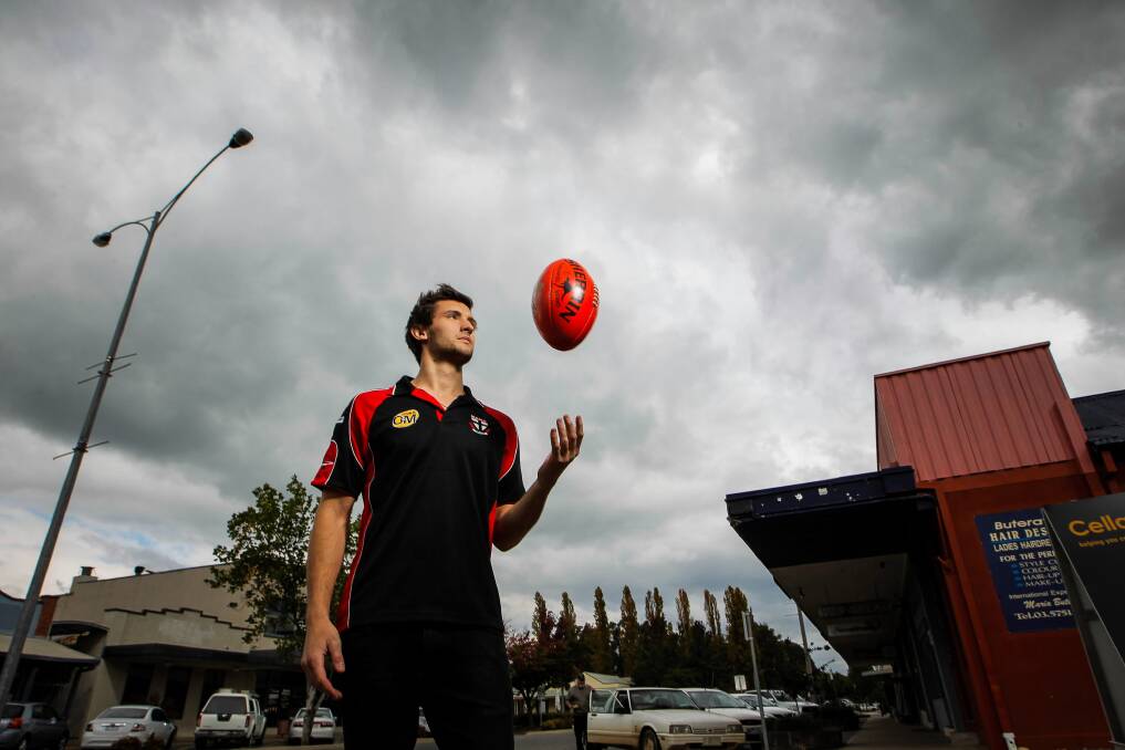 Myrtleford Saints captain Matt Dussin with his footy as clouds gather over the club. Picture: DYLAN ROBINSON 