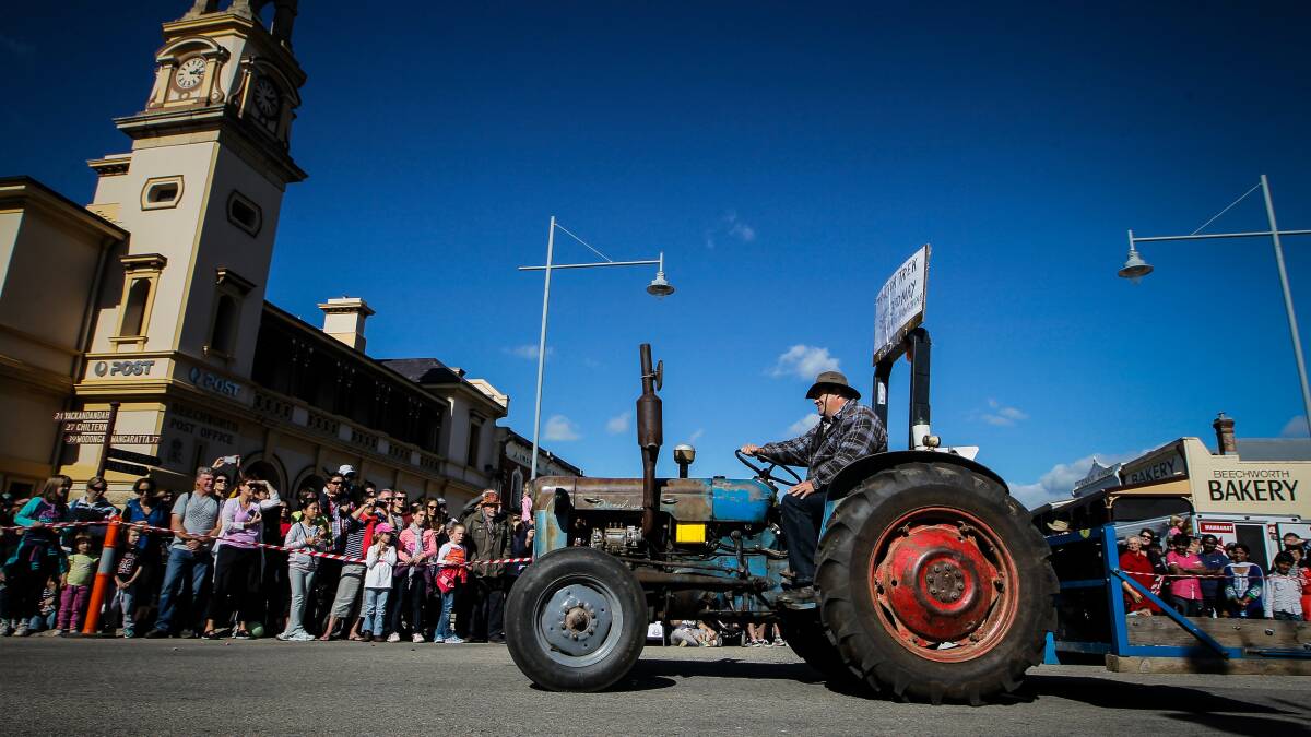 A tractor parades down Ford Street. 