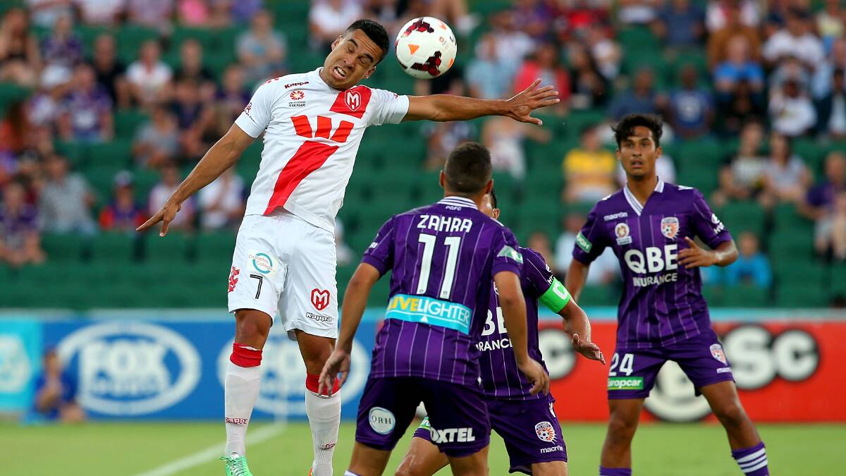  Iain Ramsay heads the ball during a match between Perth Glory and the Melbourne Heart earlier this year. Picture: GETTY IMAGES