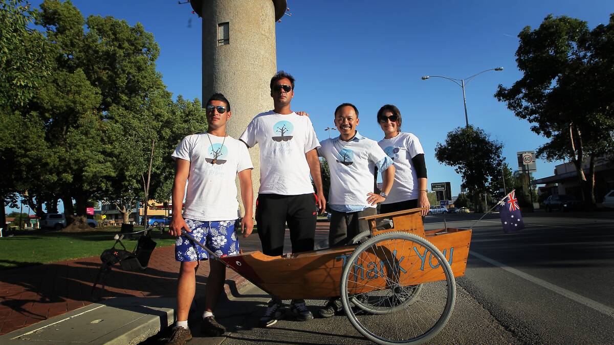 Refugee Tri Nguyen (second from right) is walking from Melbourne to Canberra with Iranian refugee's Majid, Daniel and Linda Kasravi.