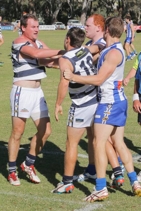 Yarrawonga's Ed Bayles got into a scuffle with the Roos' Bryce Campbell and John Robinson. 
