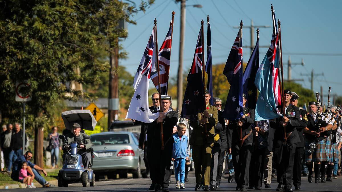 Flag bearers lead the march at Yarrawonga. Picture: DYLAN ROBINSON