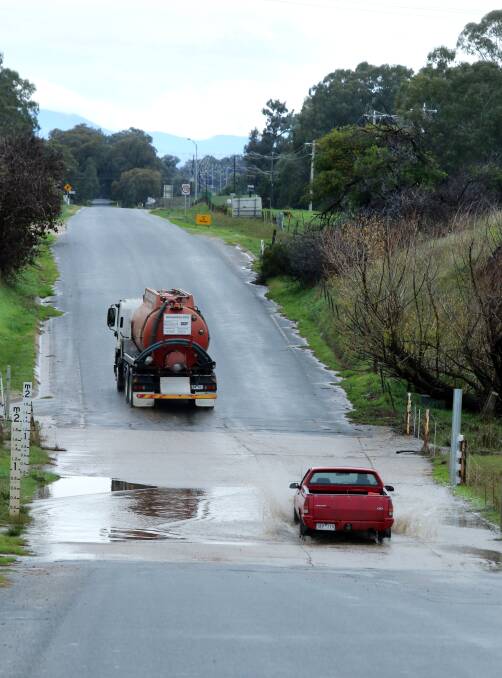 Whyte's Road was closed as water pooled in a dip that cars often get stuck in during flooding. Picture: PETER MERKESTEYN