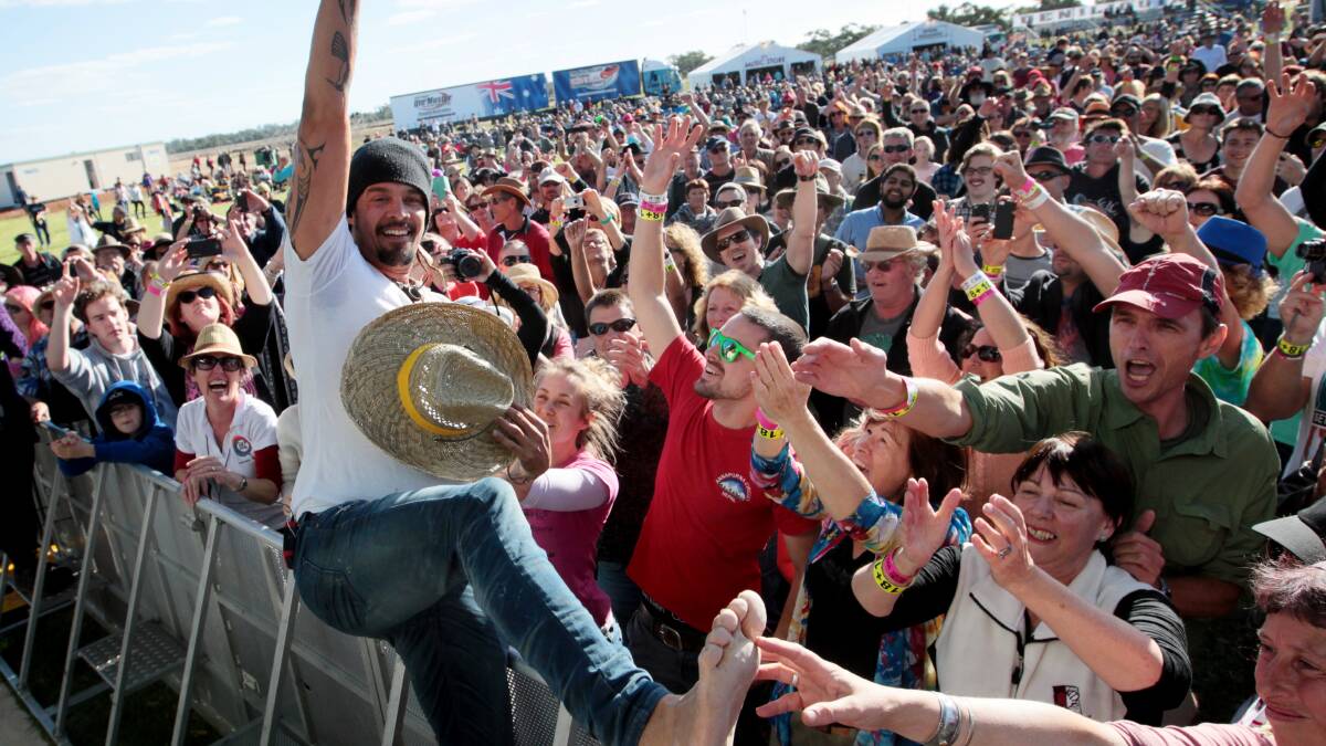 Michael Franti gets into some fun with the crowd on Saturday afternoon.