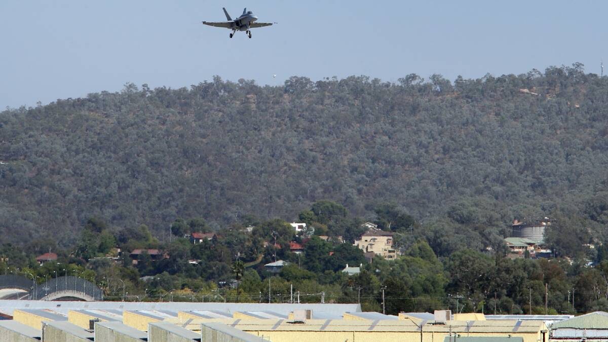 Daley McLeod flies his Royal Australian Air Force FA-18 Hornet jet over Albury yesterday. Picture: PETER MERKESTEYN