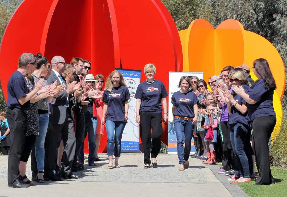 Jen Hayes, Sue O’Neill and Michelle Hudson launch the City2City Run Walk in Wodonga yesterday. Picture: DAVID THORPE
