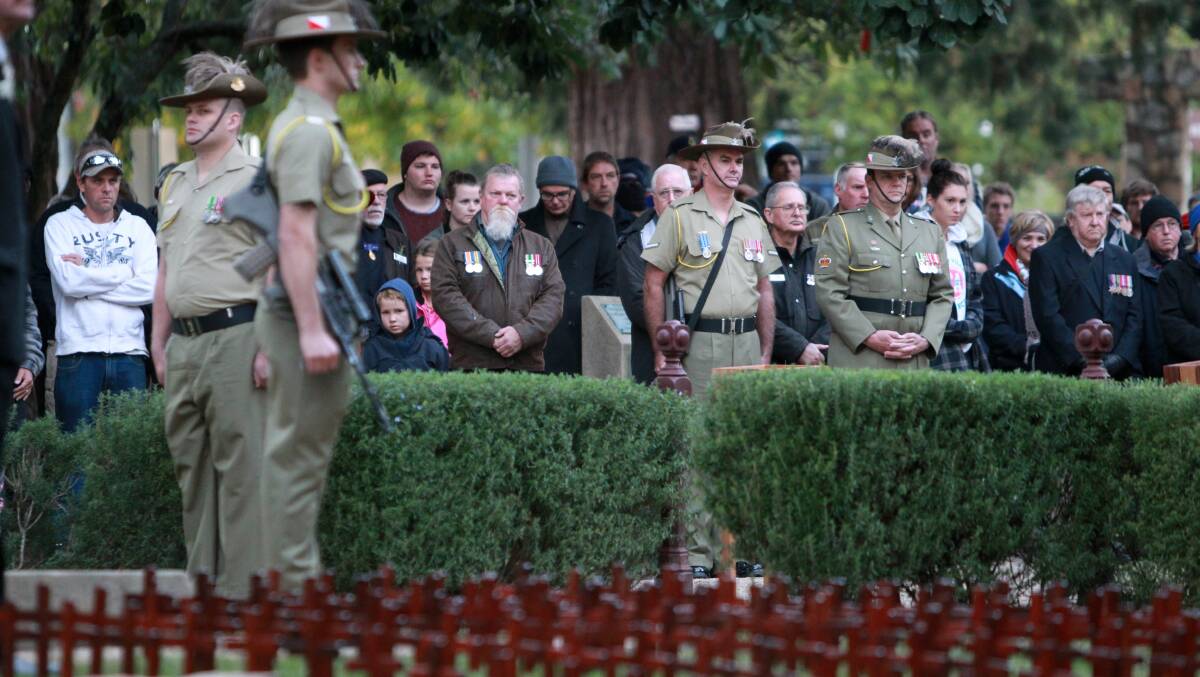 Some of the defence personnel and the crowd attending the Anzac Day dawn ceremony at Beechworth. Picture: MATTHEW SMITHWICK