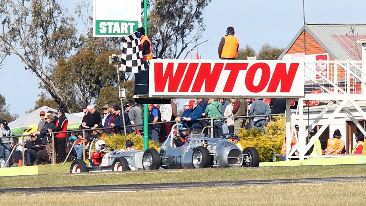 Classic cars race over the finish line at Historic Winton Raceday in 2012. Picture: TARA GOONAN
