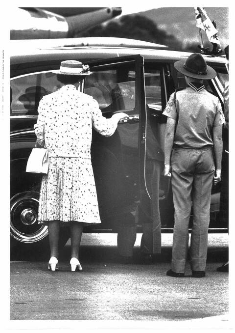 May, 1988 - Prince Philip and Queen Elizabeth II visit Albury-Wodonga. The driver is asked to collect some flowers from the back seat while the Queen holds the door for him.
