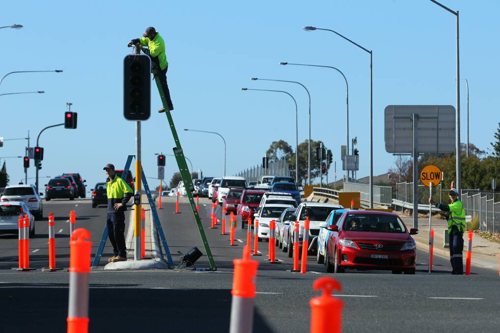 Traffic was banked up as workers installed the new lights. Picture: MATTHEW SMITHWICK