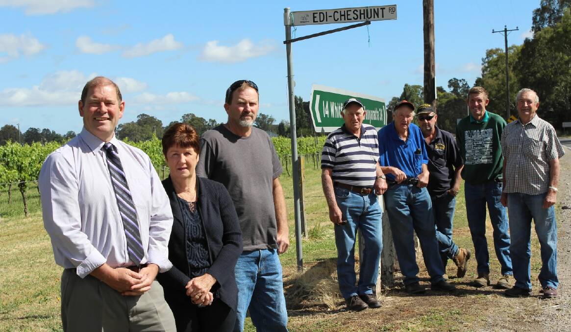 Nationals MP Tim McCurdy with Edi and Whitfield residents Sue Mildren, Tony Readhead, Robert Cook, David White, Geoffrey Mildren, Greg Whitacker and Greg Sheppard at yesterday's roads funding announcement.
Pic - Wangaratta Chronicle