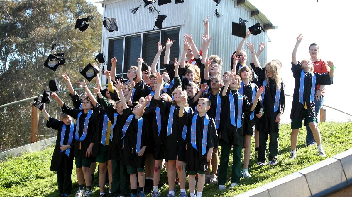 Grade 6 students from Wodonga West Primary School celebrate their "graduation" from Charles Sturt University after spending a day at the Thurgoona campus. Picture: MATTHEW SMITHWICK